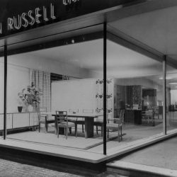 Exterior of store front. Gordon Russell Ltd sign above large window.